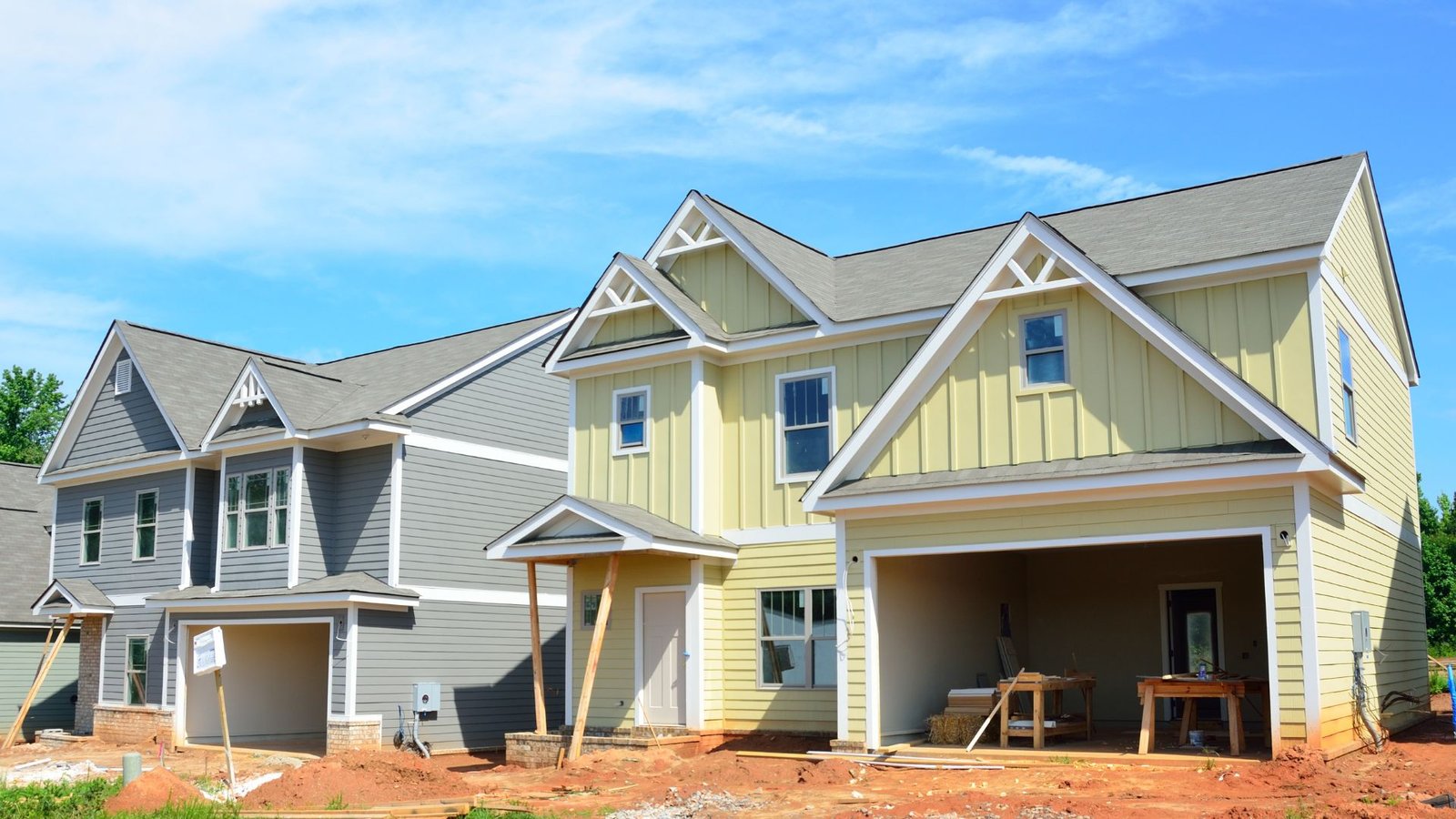 Two yellow and gray new construction homes near me