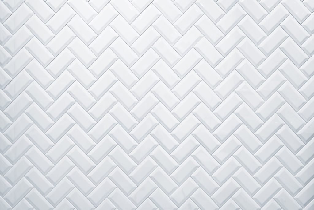A herringbone floor style with one of the 8 different types of bathroom tile