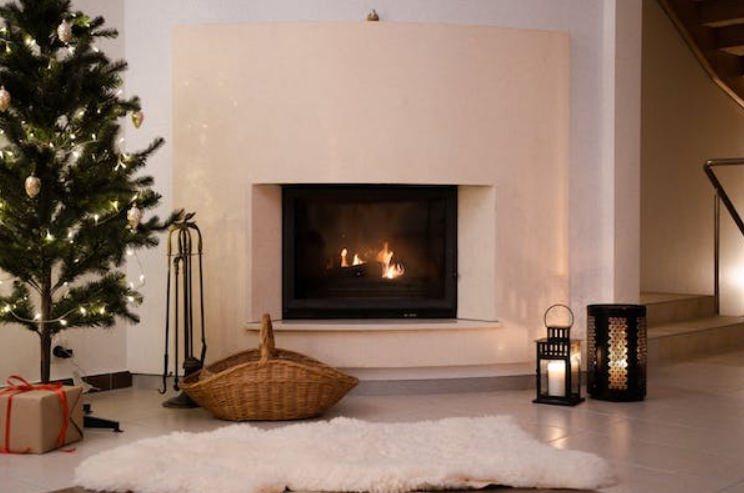 modern fireplace with Christmas tree to the side
